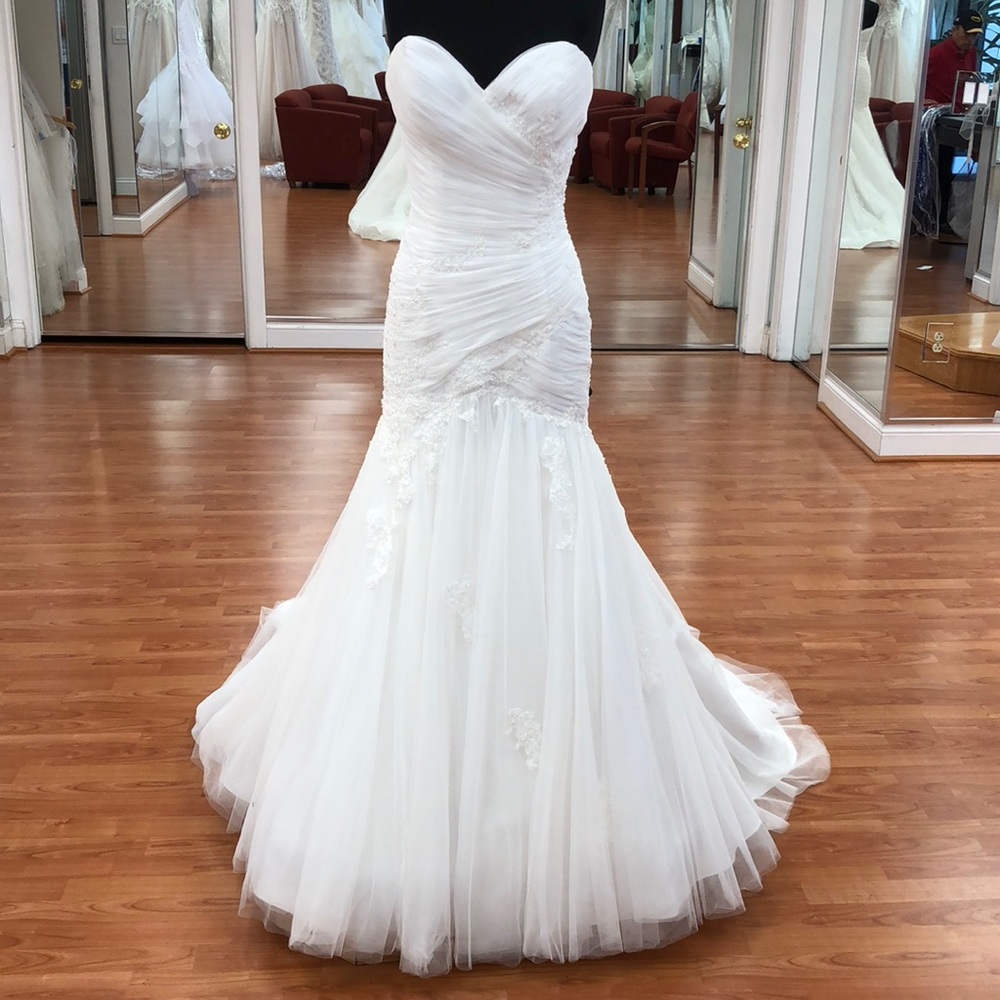 Wedding gown with lace trim and sequins